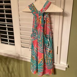 Large Lilly Pulitzer pink shirt with green leaves and yellow stars.